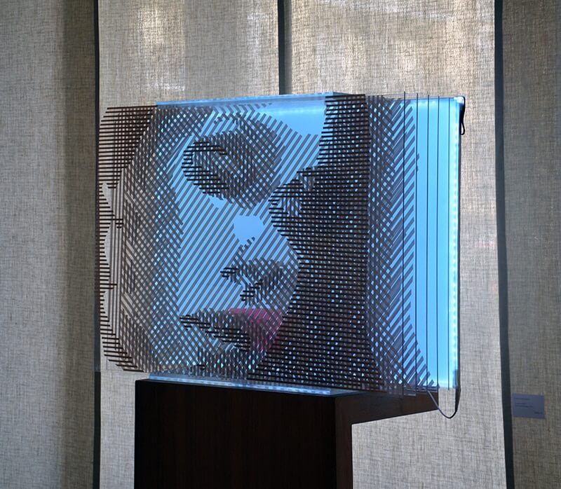 Closeup- optical art female portrait out of packing tape FAQlove Reloaded- optical art female portrait out of packing tape- side view