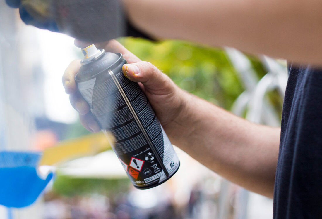 Spray can painting a mural