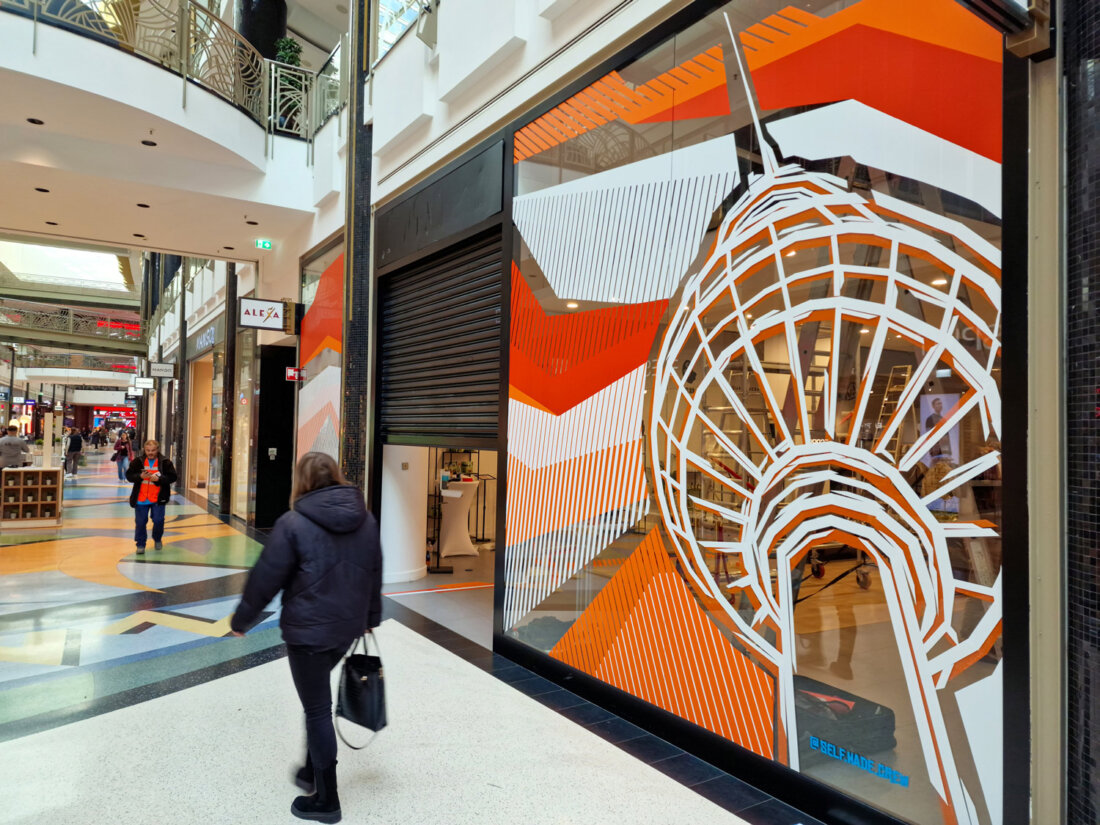 Tape art on a pop-up store in a shopping mall